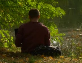 Picture of Man Reading By Stream